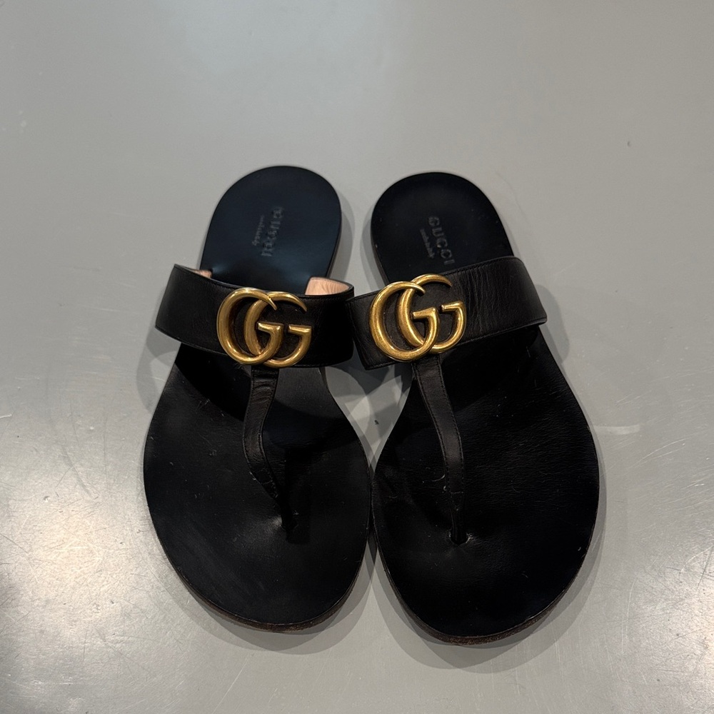 Gucci Black Slides with Gold Emblem